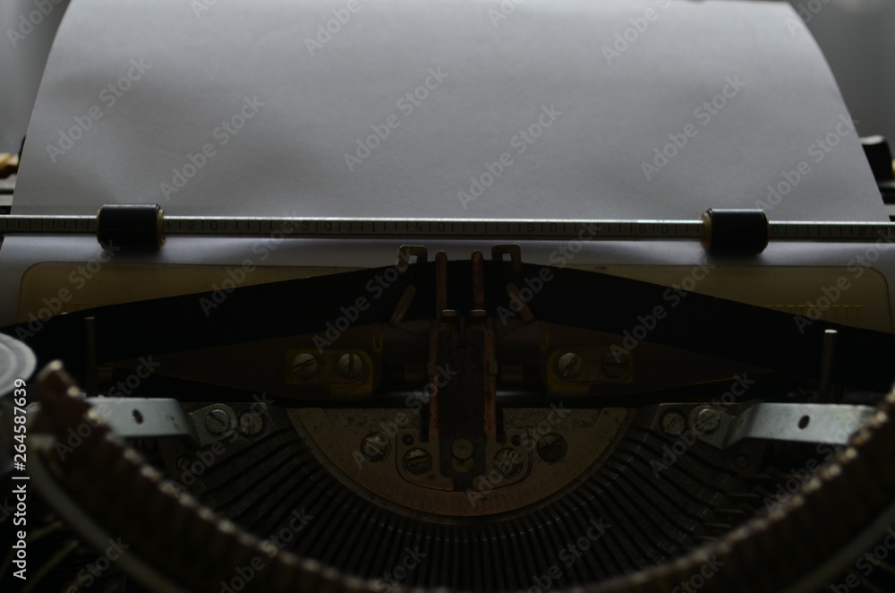 Fototapete an old manual typewriter with its working keyes with numbers and letters