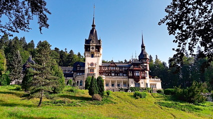 Sinaia, Romania - September 02, 2017: Peles Castle is a Neo-Renaissance castle in the Carpathian Mountains, near Sinaia, Romania, on an existing medieval route linking Transylvania and Wallachia