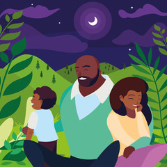 black parents couple with son in the landscape at night