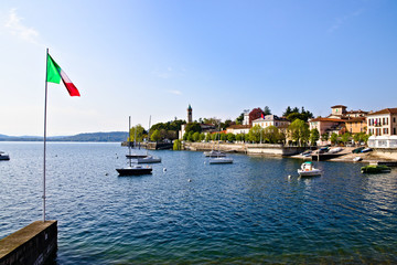 View of Lesa, little village on the coast of Lake Maggiore, Piedmont, Italy, sunny spring morning