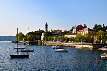 View of Lesa, little village on the coast of Lake Maggiore, Piedmont, Italy, sunny spring morning