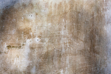 Old whitewashed weathered distressed cracked cement stone wall texture background