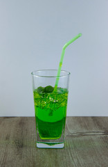 A glass of nutritious estragon drink to maintain a healthy lifestyle. Were added to the drink ice.