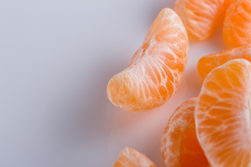 juicy mandarin on a white acrylic background