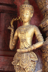 statue of divinity (?) in a buddhist temple (Wat Phra Sing) in chiang mai (thailand)