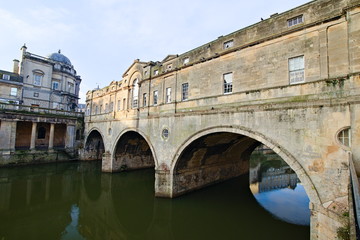 Pulteney Bridge crosses the River Avon in Bath, Somerset, England. It was completed by 1774. The bridge is 45 metres long and 18 metres wide. It is a World Heritage Site.
