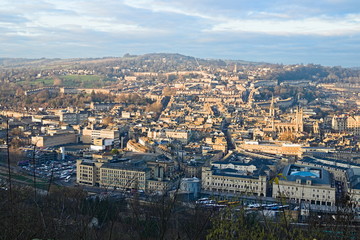 Aerial view on Bath old town at sunset from Alexandra Park, cloudy blue sky. Somerset, England
