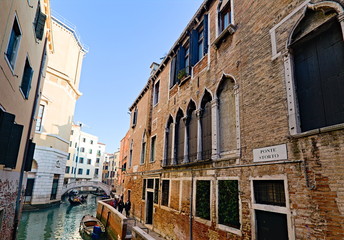 Plakat Venice, Italy - December 29, 2018: Typical view in the old town with water channels and bridges