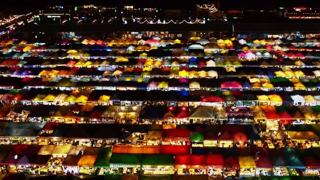 Night market called train night market Ratchada bird eye view, people visit to enjoy many kind of street food, located at back of Esplanade Ratchadapisek Department store, Bangkok, Thailand