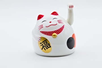 White bright toy depicting a Maneki Neko, a common Japanese figurine, on a white bright limbo background, the translation is 