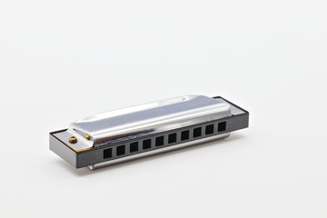 isolated silver shiny harmonica on white limbo background