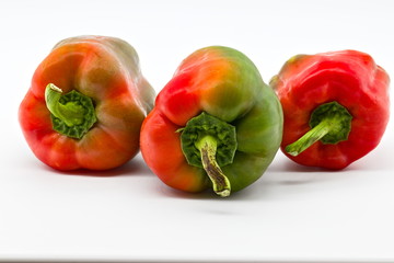 group of red and green peppers isolated on white limbo background