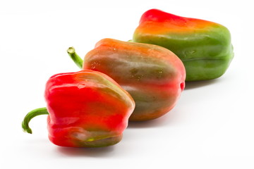 group of red and green peppers isolated on white limbo background