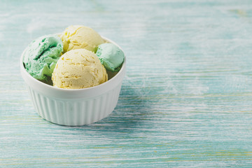 Ice cream with mint in ceramic bowl