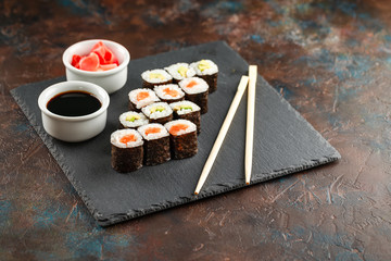 Japanese sushi on a rustic dark background.