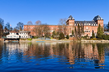 Valentino Castle in the Valentino Park on the Po river, Turin, Piedmont, Italy, bright blue sky spring morning