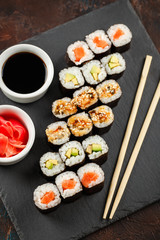 Japanese sushi on a rustic dark background.