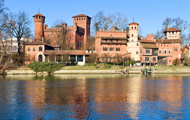 Fototapeta premium medieval fortress in Valentino Park, Turin, Piedmont, Italy, bright blue sky spring morning on the Po river