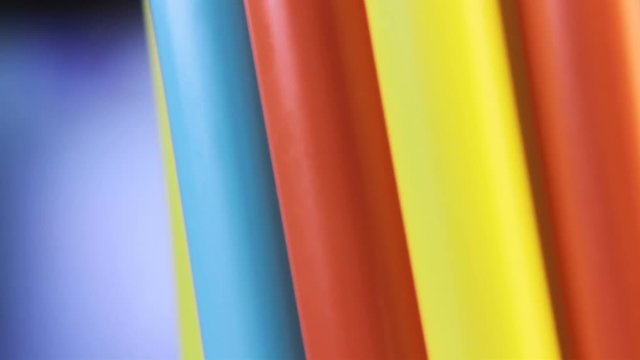 Close Up Of Colourful Plastic Drinking Straws Rotating (Looped Footage)