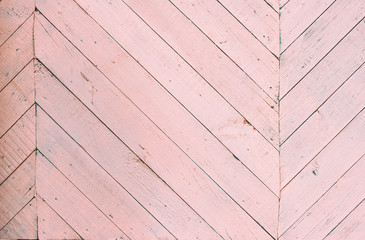 cracked old paint on wooden planks. pink