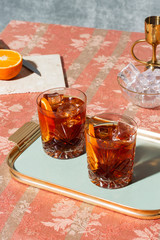 Negroni, an Iba cocktail, with 1/3 gin, 1/3 bitter, 1/3 vermut, in luxury pop style, rich and colorful.