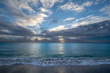 Sunrise over the ocean in Miami Beach with a cloudy sky