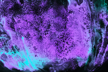 Watercolor pattern of bright purple and blue paint. Background galaxy and glow.