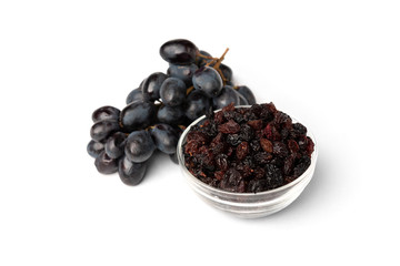 Raisin and grapes isolated on white background.