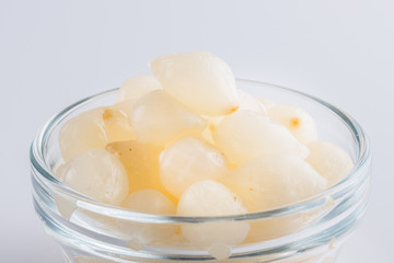 pickled vegetables on a white acrylic background