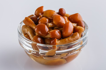 pickled vegetables on a white acrylic background
