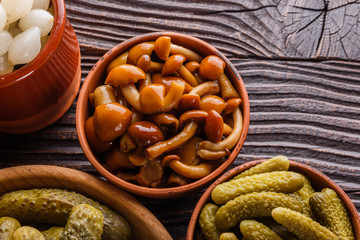 pickled vegetables on a wooden rustic background