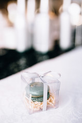 Macaron wrapped with white ribbon bows