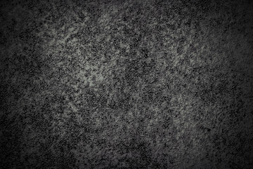 Black and white rough texture surface of exposed aggregate finish for background.