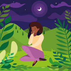 Obraz na płótnie Canvas black woman seated in the park at night