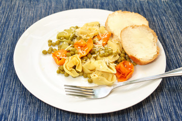 Tri-Colored Cheese Tortellini Cooked with Peas and Butter