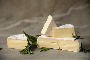 Cheese camembert or brie with fresh rosemary