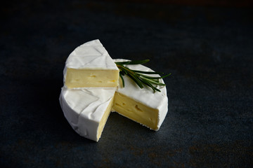 Cheese camembert or brie with fresh rosemary