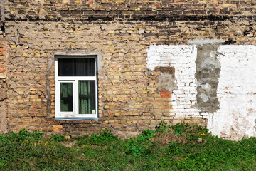 Fototapeta na wymiar Walls and windows.Old brick wall with window.