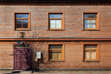 Walls and windows.The facade of the wooden house, door and windows