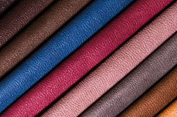 A set of samples of fabric furniture decoration lines of textile textures. Multicolored stripes upholstery. Tone for a luxurious interior style. Abstract background