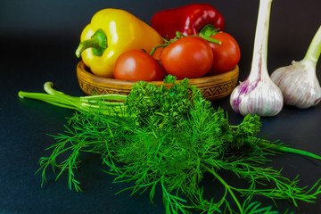 vegetables in a clay plate, fresh herbs and garlic