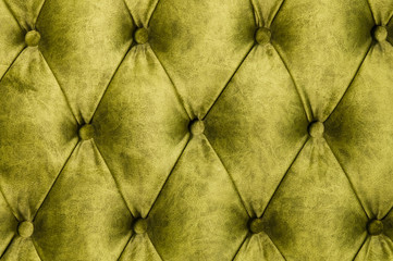 Velor lime surface of sofa close-up. Training equipment-velor mats tightened with buttons. Yellow...