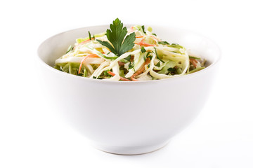 Coleslaw salad in white bowl isolated on white background. 