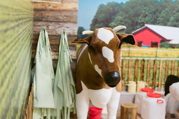 Fototapeta na wymiar children's toy farm. Toy sheep, pig, cow large on a farm