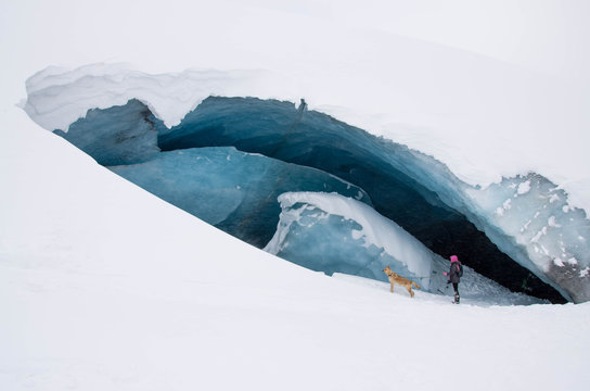 girl stands near ice berg
