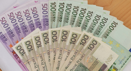 Polish złoty and Euro banknotes.