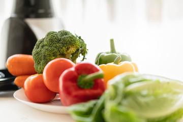 healthy food and good eating with fresh vagetable with blender machine morning light window background