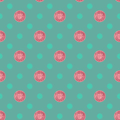 Seamless pattern with pink glitter dots on a green background
