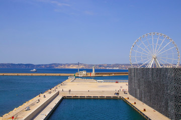Coast line of Marseille, view to MuCEM (Museum of European and Mediterranean Civilisations) and to the ferris wheel, France