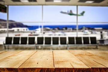 Desk of free space and airport background 